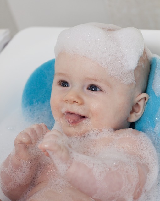 baby bathing in bubbles